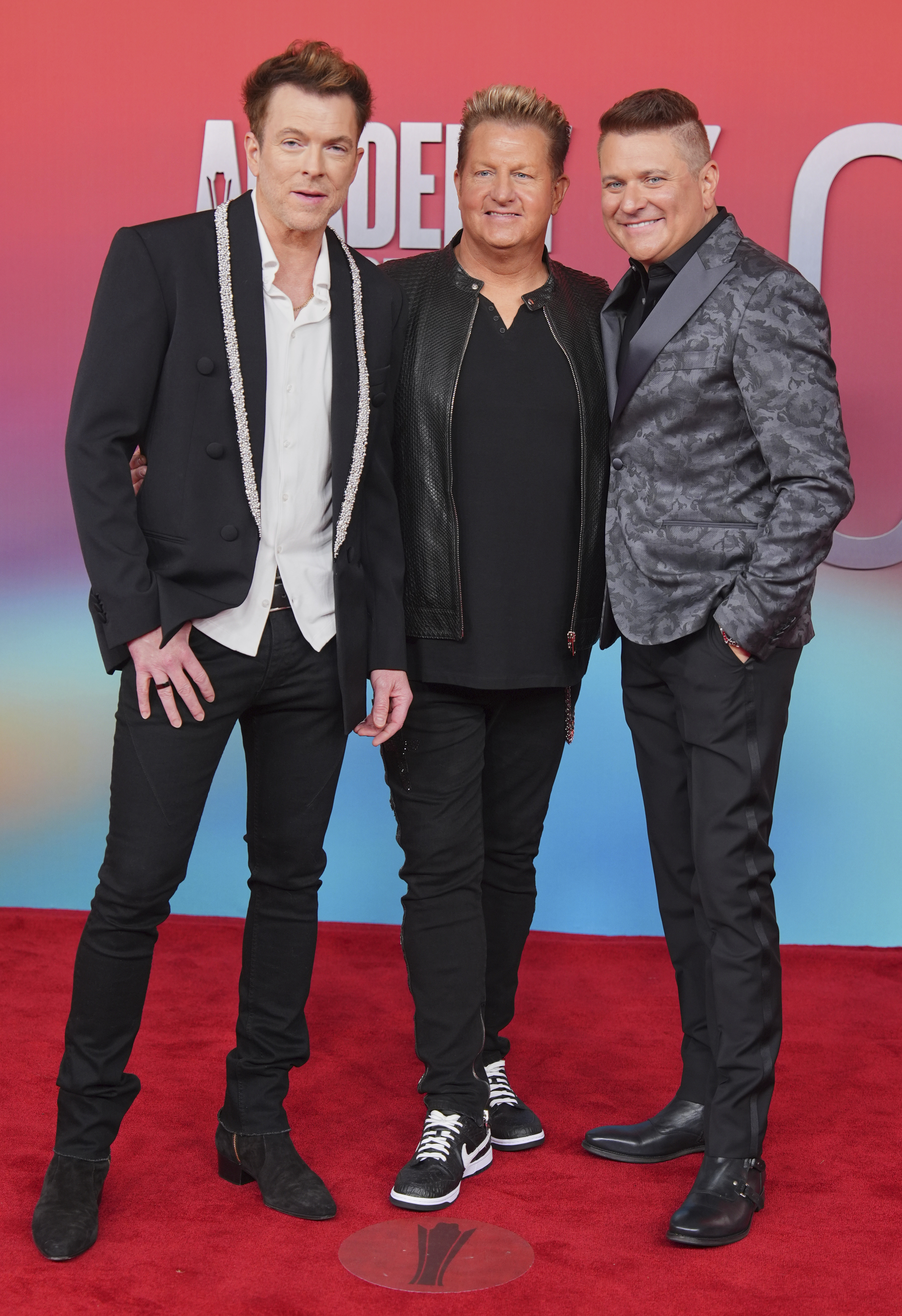 Joe Don Rooney, from the left, Gary Levox and Jay Demarcus of Rascal Flats arrive at 60 Academy of Country Music Awards Thursday, May 8, 2025, in Frisco, Texas. 